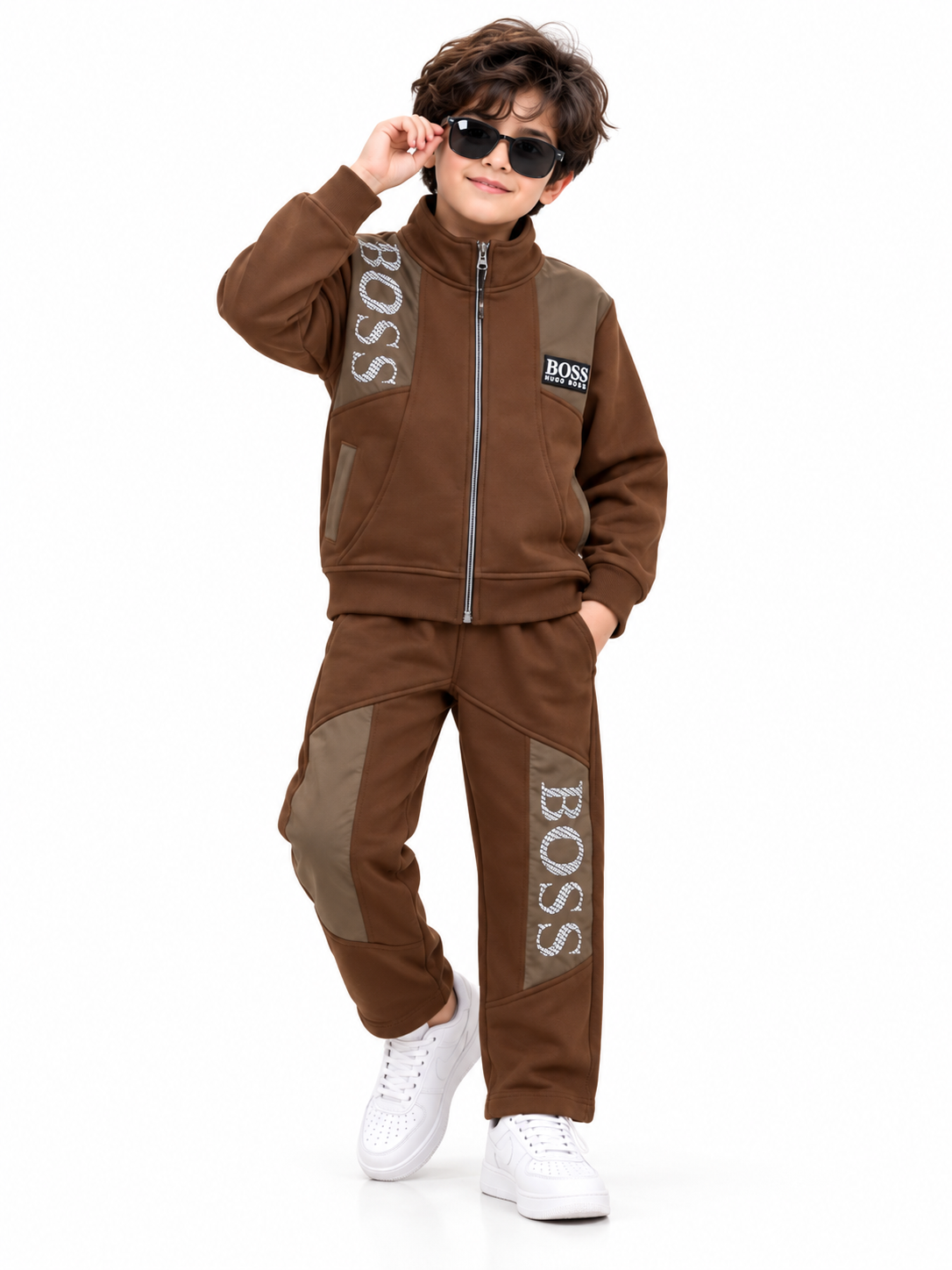 Young Boy in Brown Tracksuit